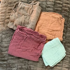 Set of Four MomCozy Muslim Swaddles in Assorted Colors.